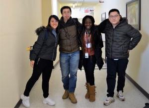 International Students posing in hallway